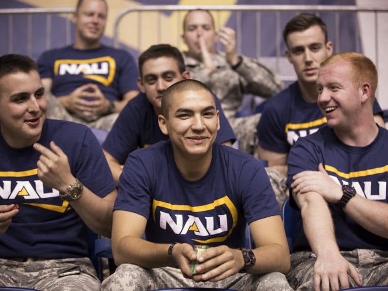 Veterans cheering on the NAU football team.