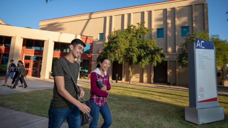 Students walking outside at the Yuma campus.