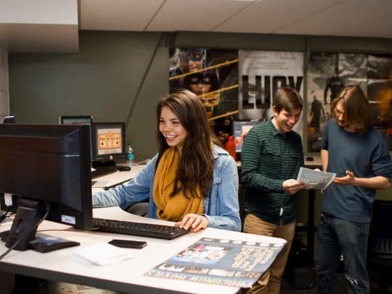 NAU student workers working at their desks.