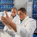 Matt Salanga and Phillip Kalaniopio working in lab
