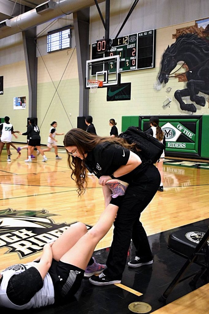 Hailey Caristo in action as an Athletic Trainer.